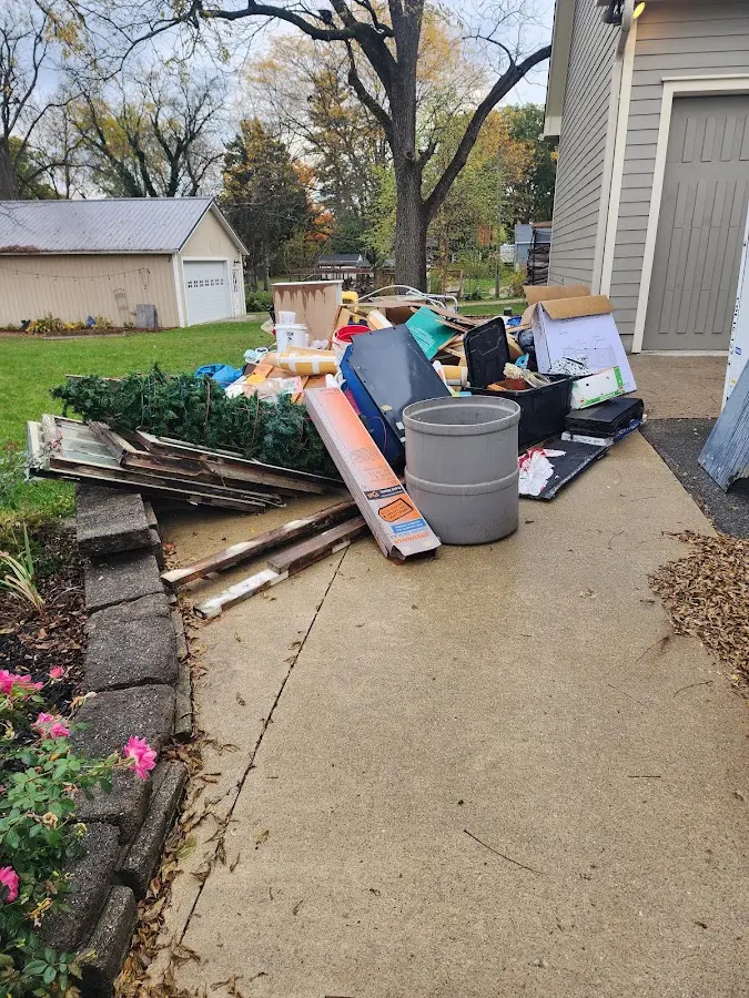 Dumpster being loaded with debris for Residential Dumpster Rental in Verona